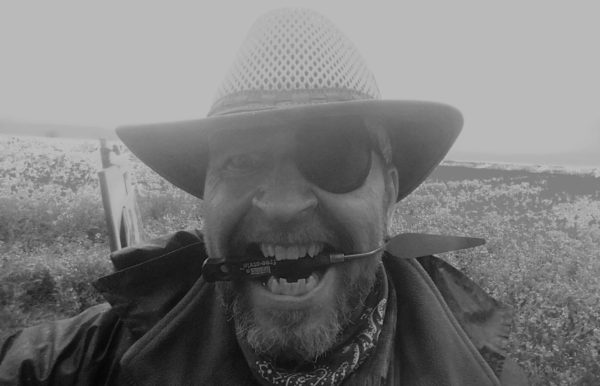 The pirate painter with a palette knife between his teeth.