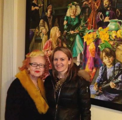 Gallerist and curator Dr. Noelle Campbell-Sharpe with an interested collector.
