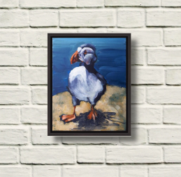 Photo of Rod Coyne's Patrolling Puffin acrylic on canvas, black-framed, on warm wall.